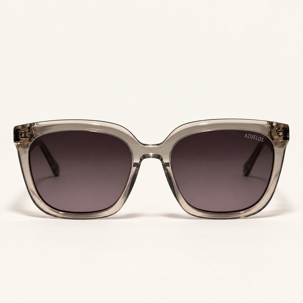 Lunettes de soleil femme AZUELOS Avery C3, monture gris fumé translucide, vue de face.