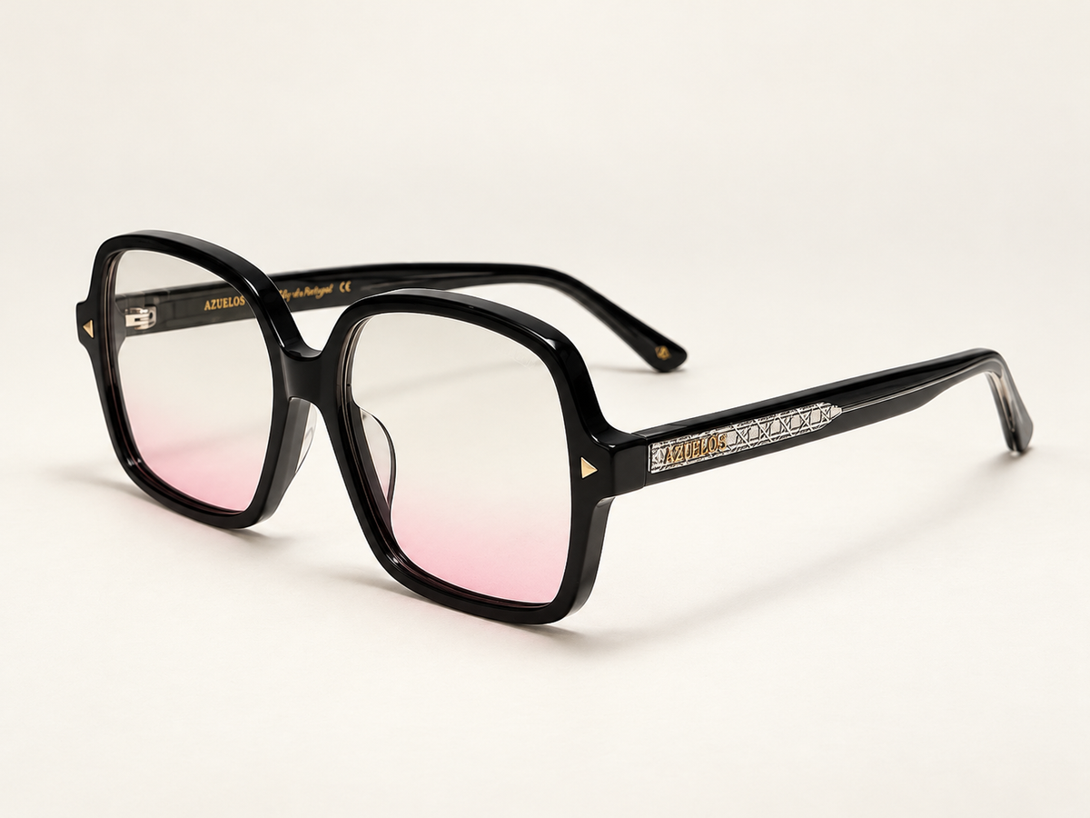 Zoya photographed from a three-quarter angle, with pale pink lenses and black temples