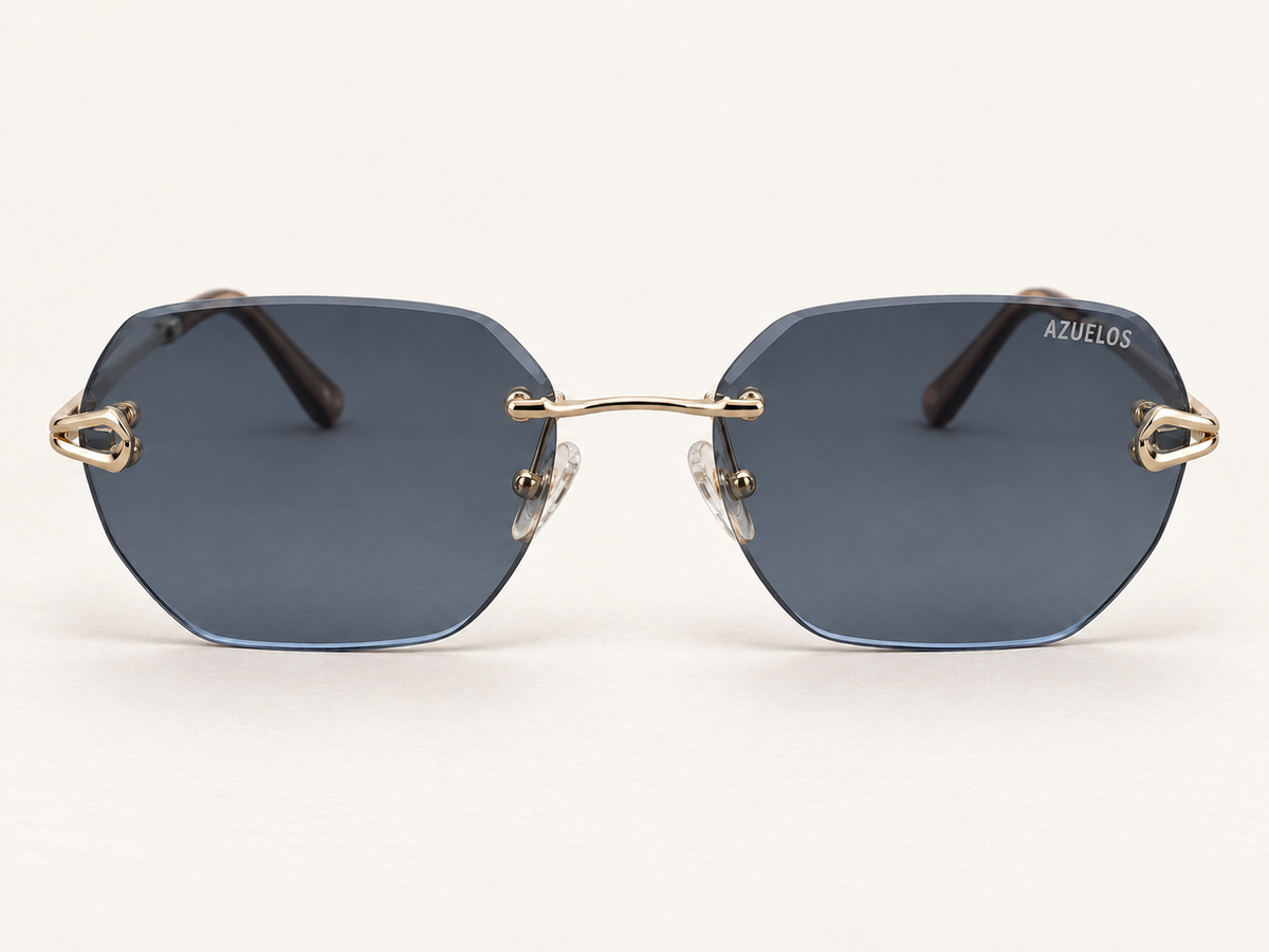 Enzo C1 de face : verres bleu-gris sans cerclage, pont et attaches métalliques, sur fond ivoire.