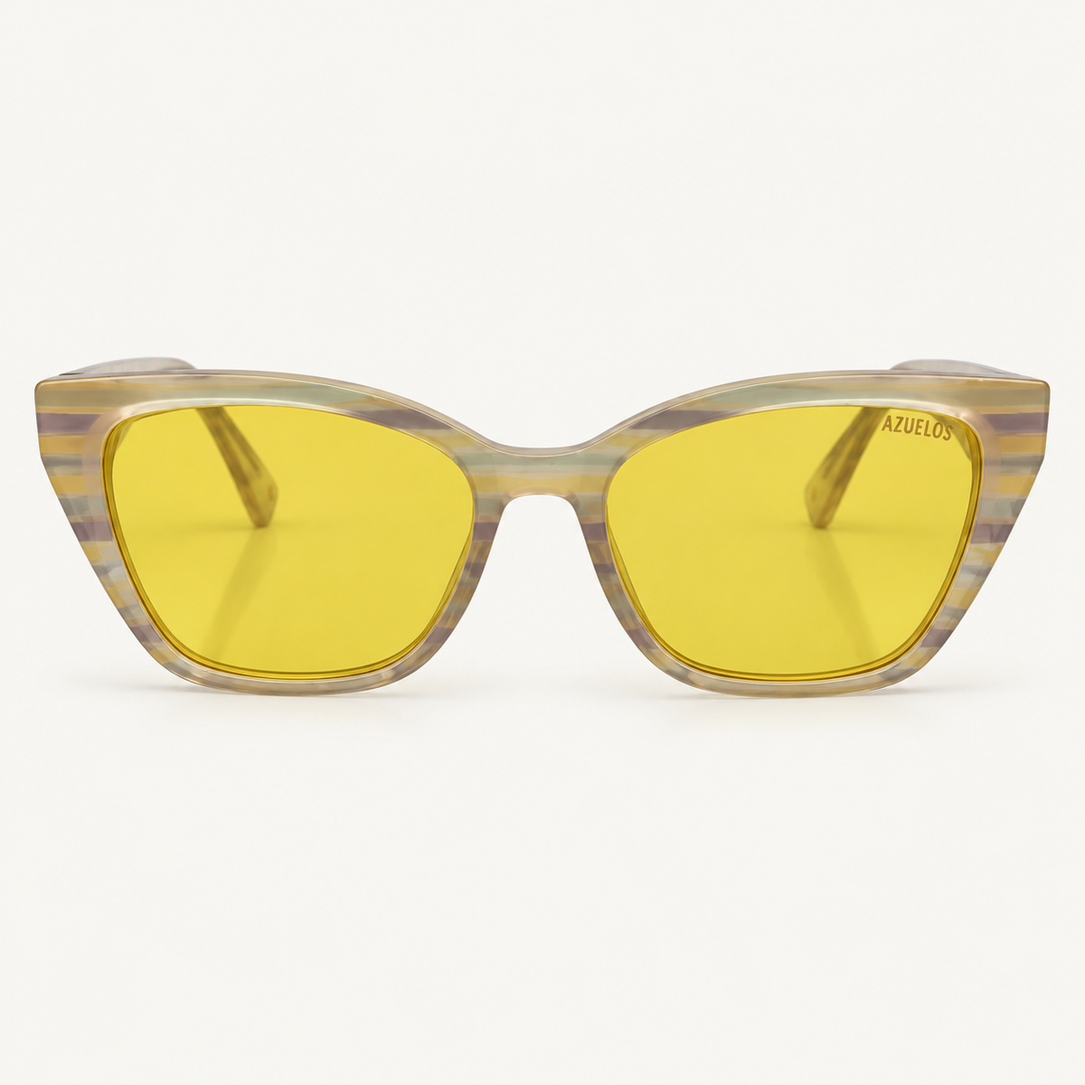 Vaughn C6 — lunettes de soleil femme à forme papillon, monture translucide rayée et verres jaunes, vue de face.